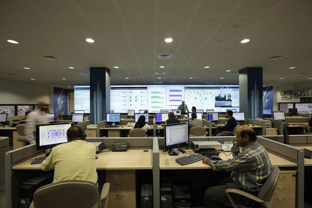 Analysts Take a Closer Role in Triaging AI-Flagged Alerts cybersecurity analyst monitoring multiple screens