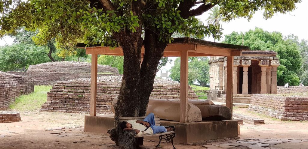 Consistent Sleep Routines Support Better Mental Health A person sleeps peacefully in a dark, quiet bedroom at night.