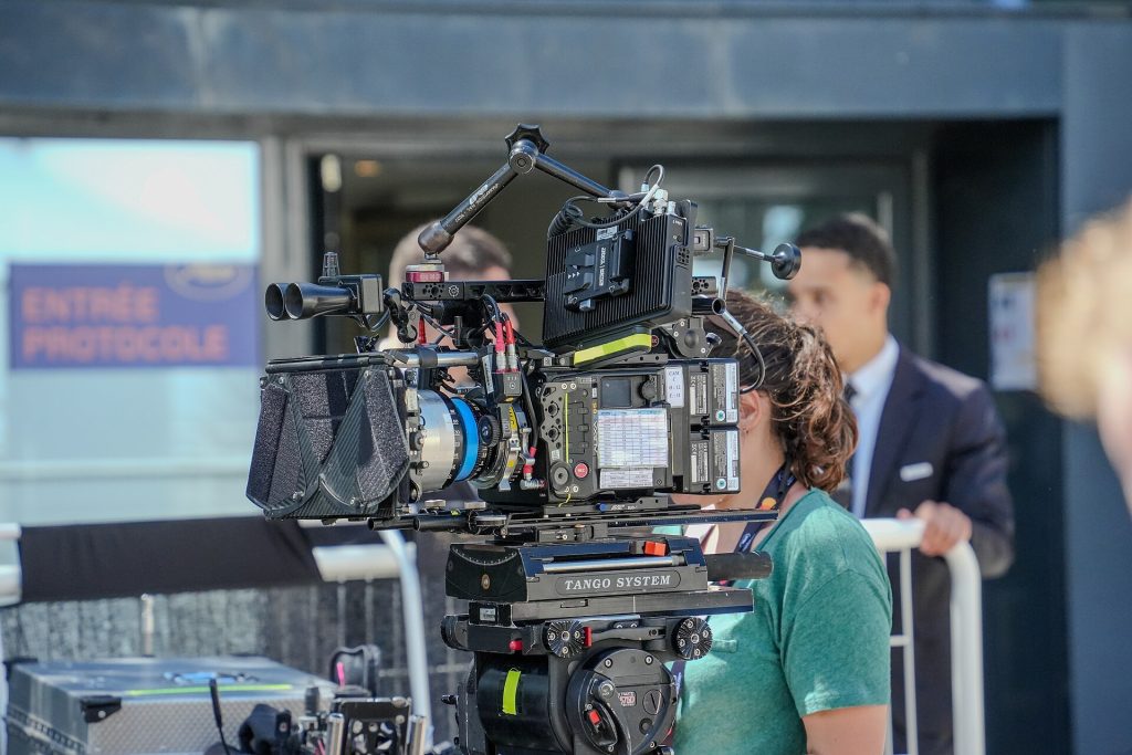 Eugenio Derbez: How Mexico’s Comedy King Conquered Hollywood Cinema auditorium with rows of red seats facing a big screen
