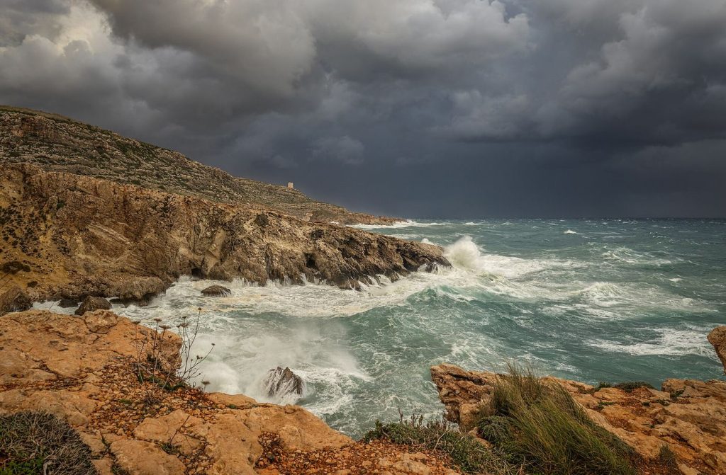Atlantic Storm Season Tests a New Generation of Forecasts Storm waves crashing against a rocky coastline under dark clouds
